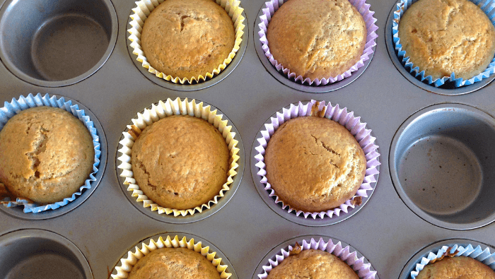 Peach strawberry breakfast muffins in a muffin tin