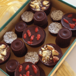 home made chocolates in a box tied with gold ribbon
