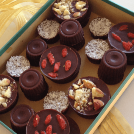 home made chocolates in a box tied with gold ribbon