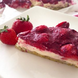 A slice of strawberry tart on a plate