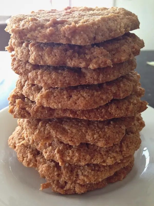 Anzac biscuits stacked on a plate