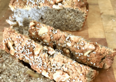 Banana walnut bread slices on a chopping board