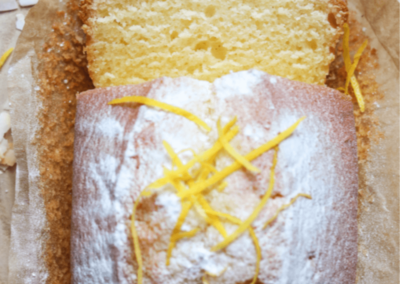 Lemon vegan coconut cake slices on a chopping board