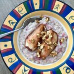 Coconut milk porridge topped with baked pear