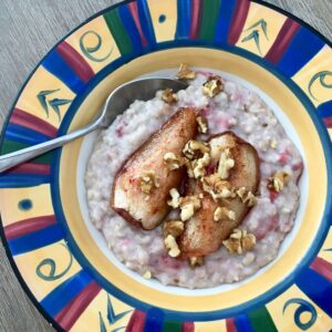 Coconut milk porridge topped with baked pear