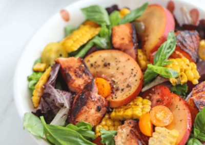 Salmon and peach salad in a bowl
