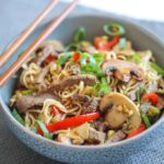 Quick chow mein in a bowl with chopsticks on the side