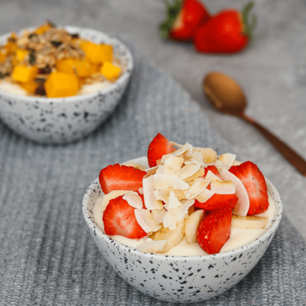 Yoghurt bowls topped with fruit and nuts