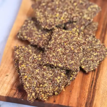 Close up of flaxseed crackers on a board