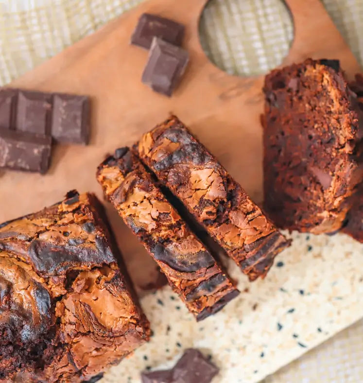 Chocolate peanut butter zucchini bread slices on a chopping board