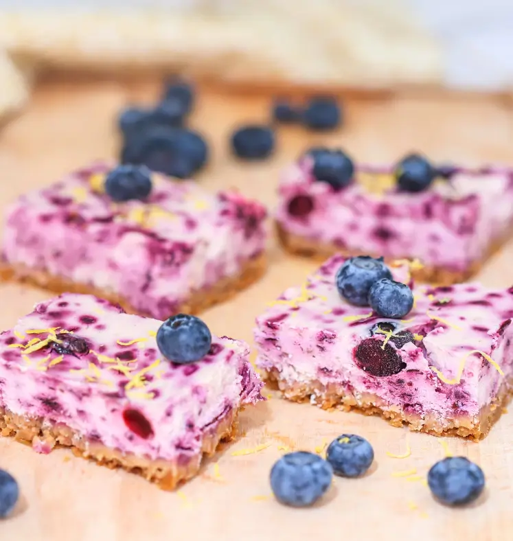 Closeup of cheesecake bites on a chopping board