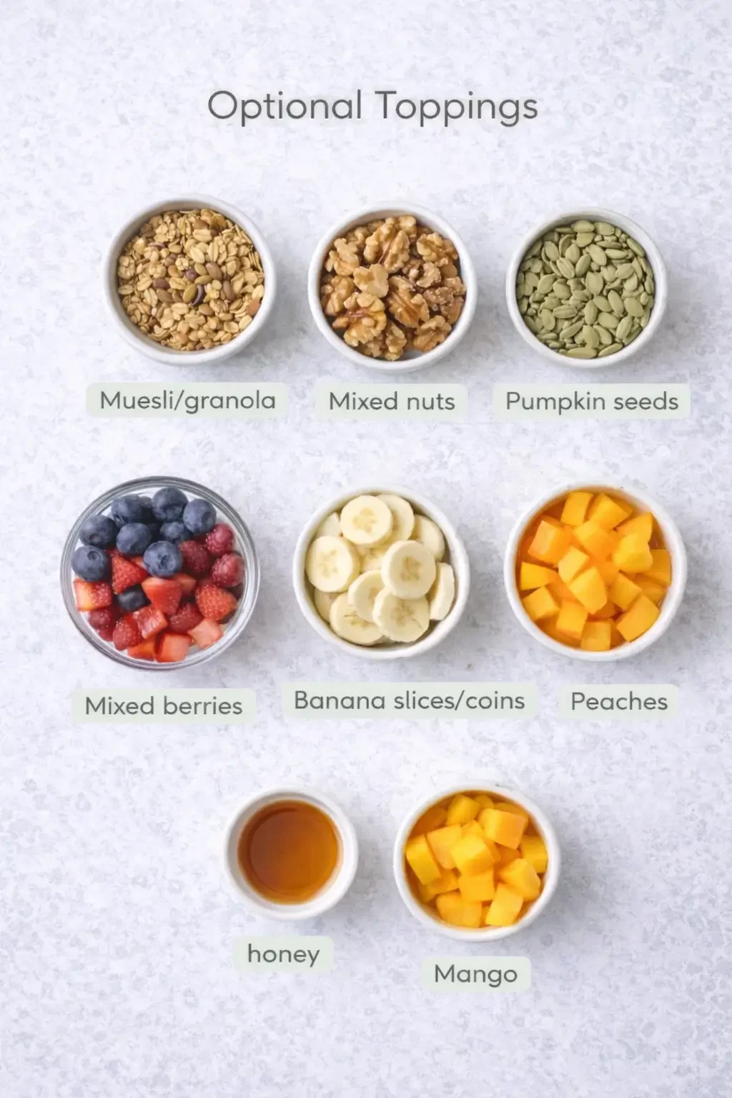 Small pots of toppings: nuts, seeds and fresh fruit