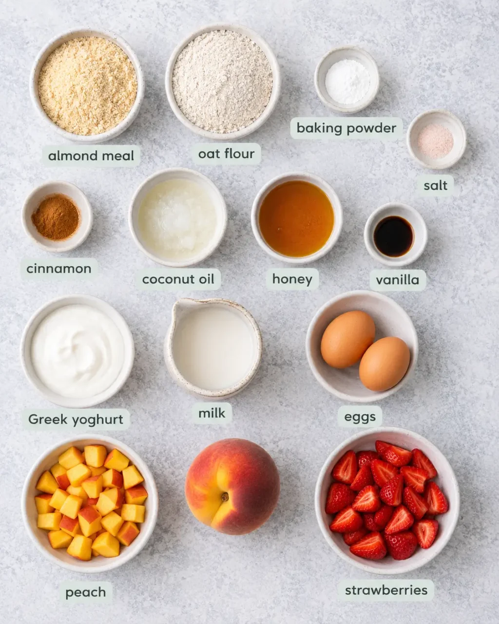 Flat lay of the peach strawberry muffins ingredients