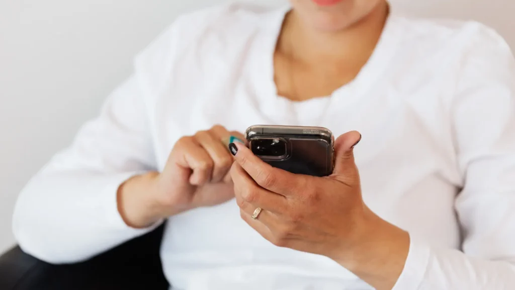 Woman looking at a tracking app on her phone