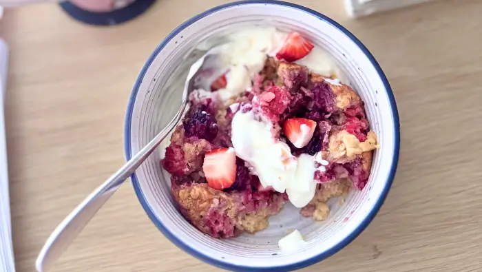 Berry baked oats in a bowl with Greek yoghurt